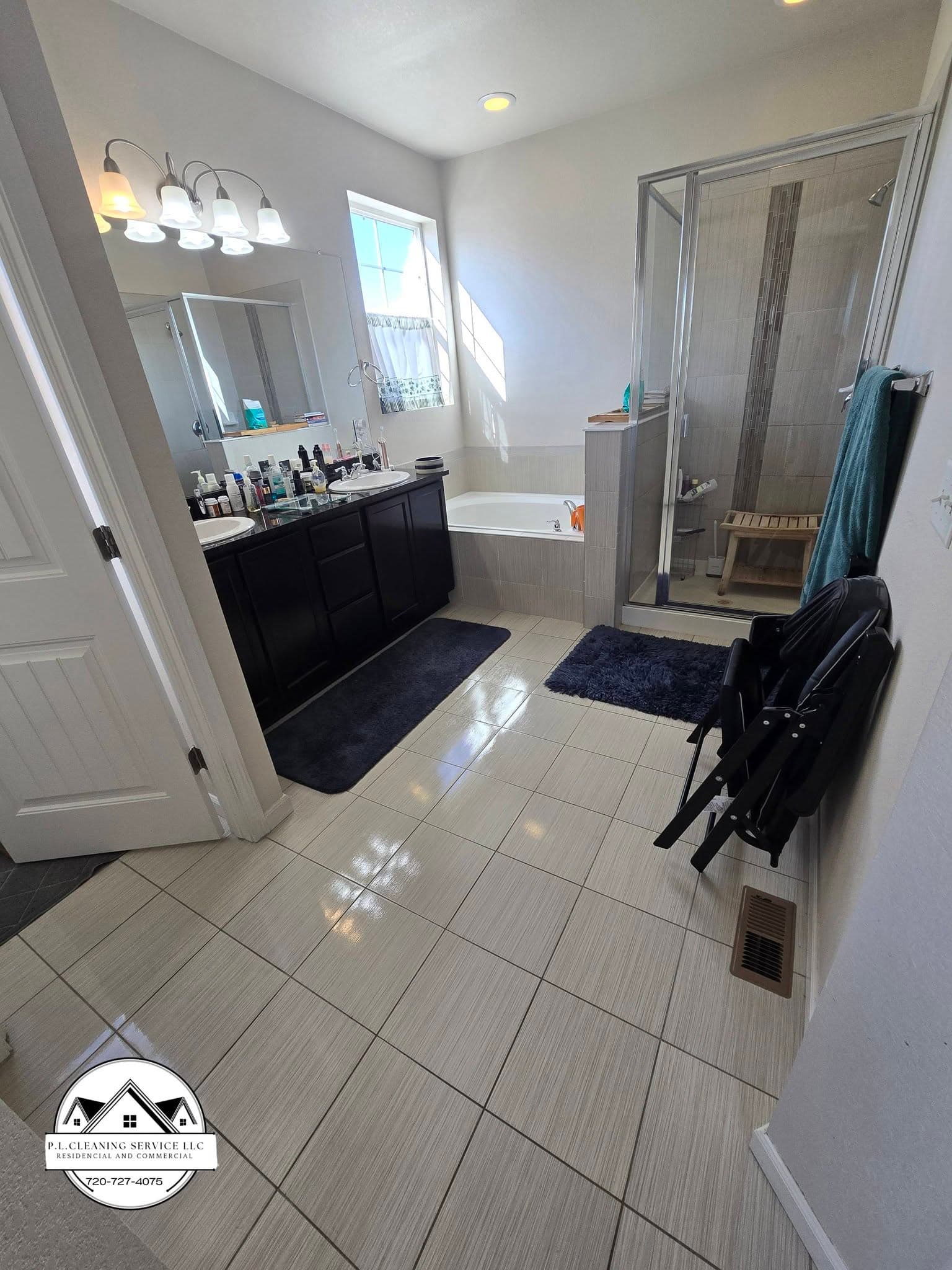 Bathroom with white cabinetry and tile